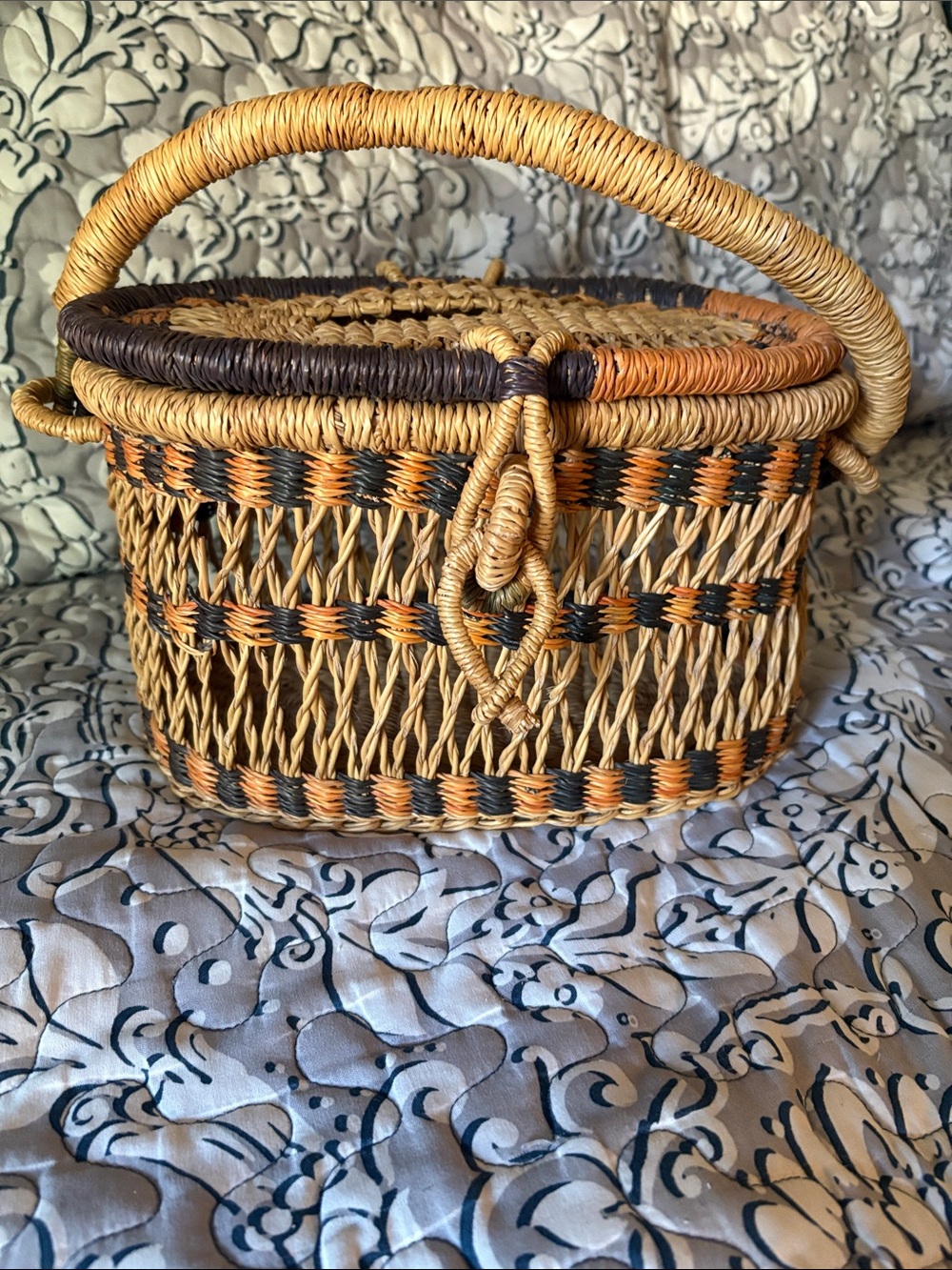 Woven  Natural Basket with Black and Orange Accent Handle